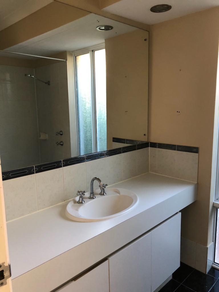 modern bathroom with big mirror and washbasin
